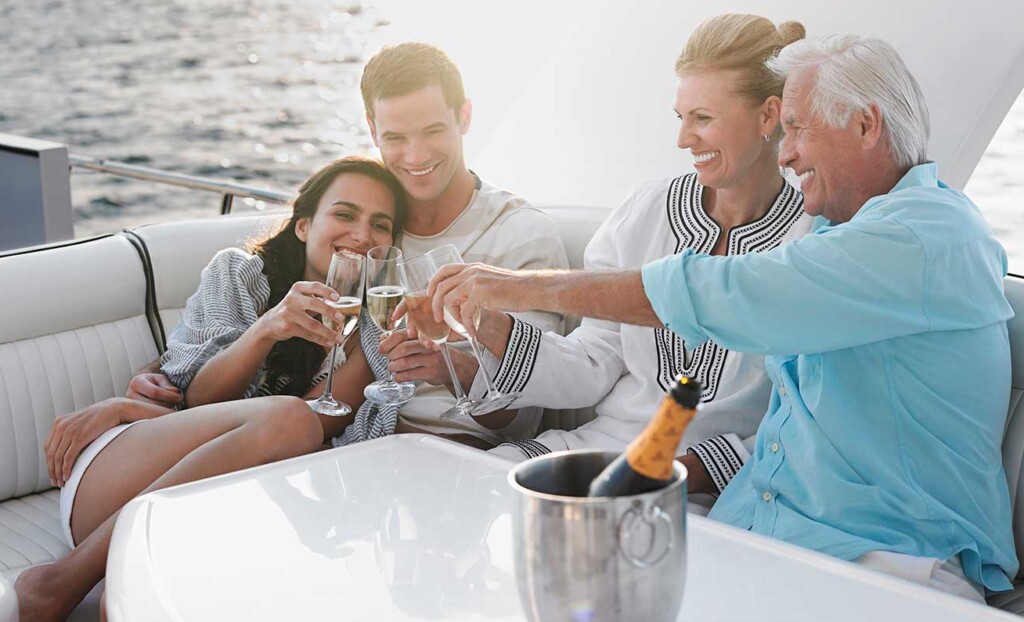 Family enjoying boat hire with champagne
